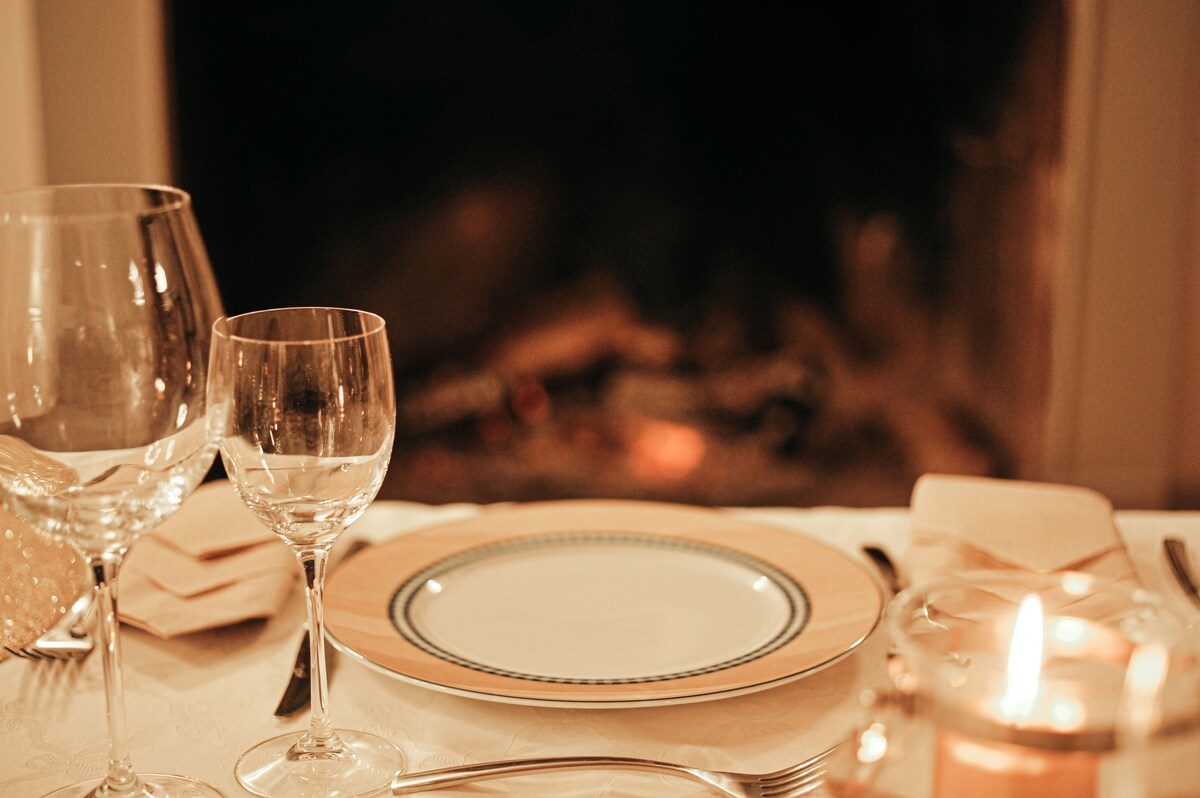 A table laid by candlelight
